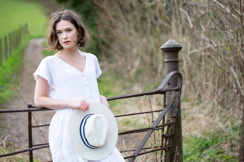 A beautiful white cotton nightdress with mother of pearl button up fastening, capped sleeves, pockets and cotton linen pleated details. A great nightie for night or day!